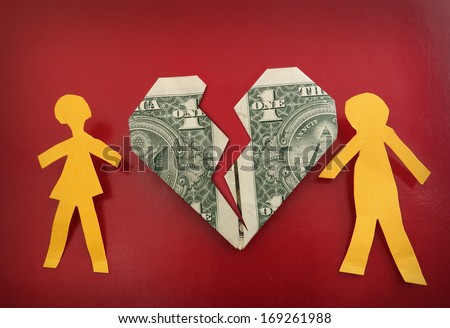 paper couple on broken dollar heart                                 Royalty-Free Stock Photo #169261988