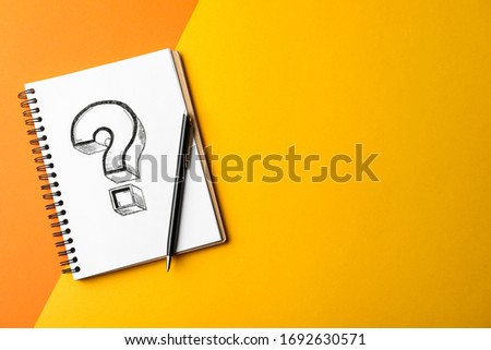 Notebook with question mark and pen on color background, top view. Space for text