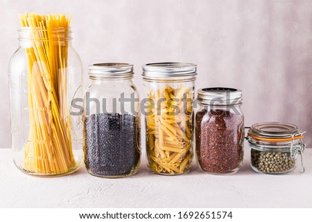 pasta beans and grains to store in your pantry that have a long shelf life to minimize food shopping during quarantine. Royalty-Free Stock Photo #1692651574