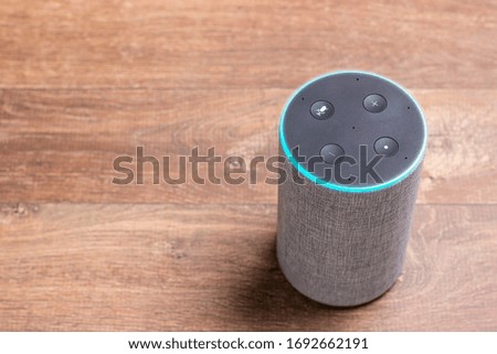 virtual assistant on a wooden background for graphic composition with copy space about technology