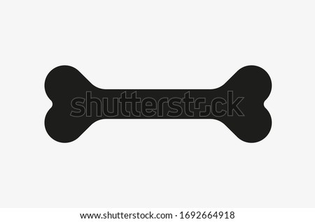 Black vector illustration of bone isolated on white background. Symbol of dog food. Bone icon vector. Royalty-Free Stock Photo #1692664918