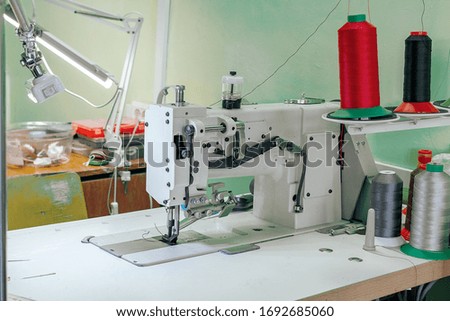 professional production sewing machine close-up, leather production, seamstress, tailor