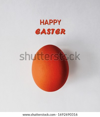 Lettering artwork illustrating red egg with white background.