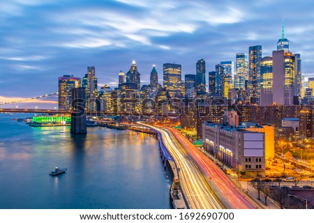 Aerial view of the New York City skyline along the FDR from the Manhattan Bridge at sunset