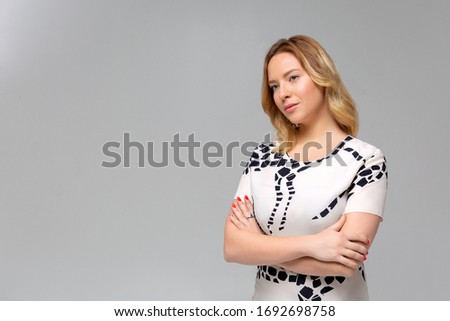 Portrait of a beautiful young woman thinking