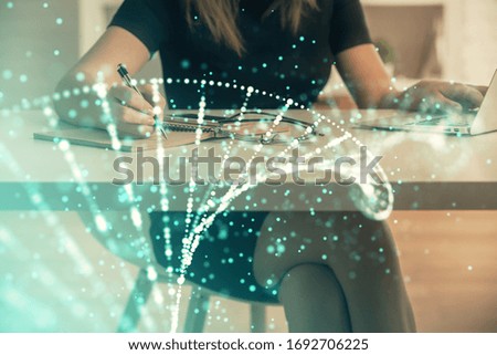 Double exposure of woman hands typing on computer and DNA hologram drawing. Medical education concept.