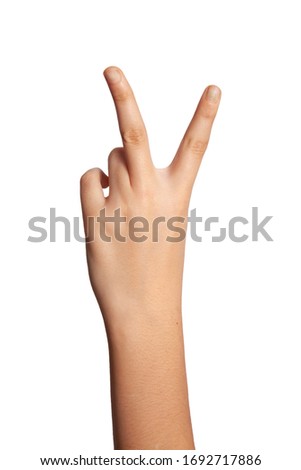 Woman in white background is pointing three