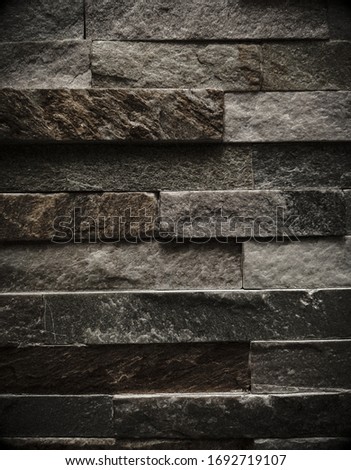 A stone wall as a background or texture. An example of masonry as the lining of external walls.