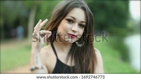 
Portrait of hispanic latina girl looking to camera smiling