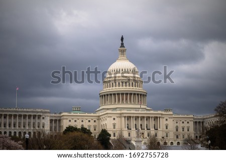 The U.S. Capitol building is empty after the COVID-19 coronavirus pandemic forces staffers to telework. Royalty-Free Stock Photo #1692755728