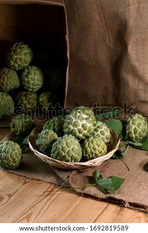 Buah Srikaya. The sugar-apple, or sweetsop, is the fruit of Annona squamosa. The flesh is fragrant and sweet, creamy white through light yellow, and resembles and tastes like custard