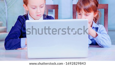 Teamwork concept. Humorous photo of group of two young business child girl working, communicating and having online meetingwhile.