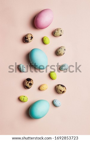 easter greeting card concept. set of varios painted pastel colorful easter egss on pink backround. Easter background. flatlay with copyspace