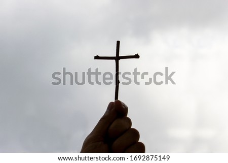 Black silhouette on the background of the crucifixion of Jesus Christ It is hope, love and freedom.