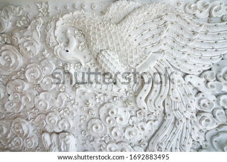 antique vintage white swan wall in temple of chiang rai thailand 