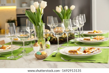 Festive Easter table setting with floral decor in kitchen