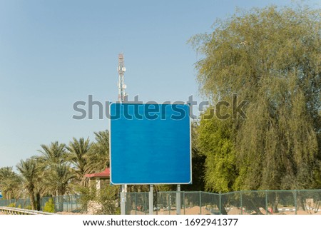 Blank Blue highway Road Sign on the road side