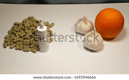 comparison of the benefits of tablets and other medications with garlic and fruit. 