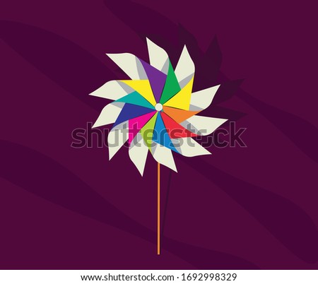 Multi colour pinwheels fan on dark background