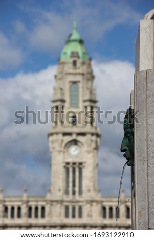 fountain head with civic hall tower in background Porto