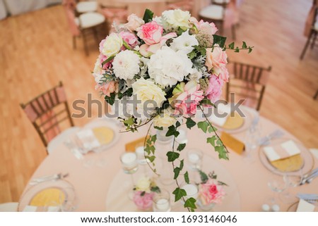 Wedding table decoration with flowers and candles