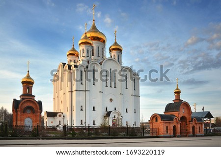 Cathedral of St. Stephen of Perm The Orthodox Spiritual Center in Syktyvkar. Spring clouds over the temple. Royalty-Free Stock Photo #1693220119