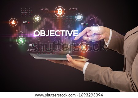 Close-up of a touchscreen with OBJECTIVE inscription, business opportunity concept