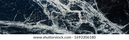 Beautiful white and black marble background. Elegant granite design can be used for wall , table and floor. Close up and  Panorama backdrop
