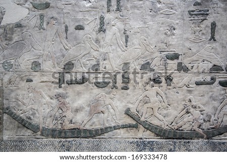 Frescoes and hieroglyphics on the wall of an Egyptian temple of Egyptian museum Berlin