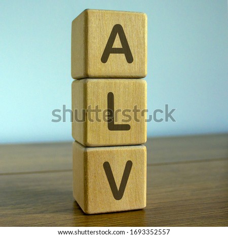 COVID-19 Pandemic Coronavirus concept. Wooden cubes with the inscription ALV. Royalty-Free Stock Photo #1693352557