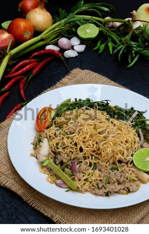 instant noodles spicy salad - Thai Style with Vegetable on Sackcloth and Wooden background