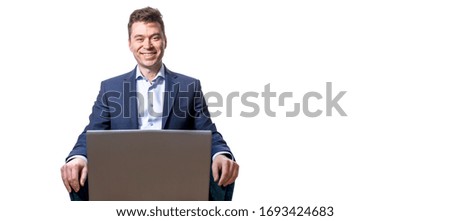 Portrait of a smiling man wearing a business suit using laptop computer, home office during quarantine. coronavirus pandemic. Self isolation. Remote work. Copy space. Isolated on a white background. 