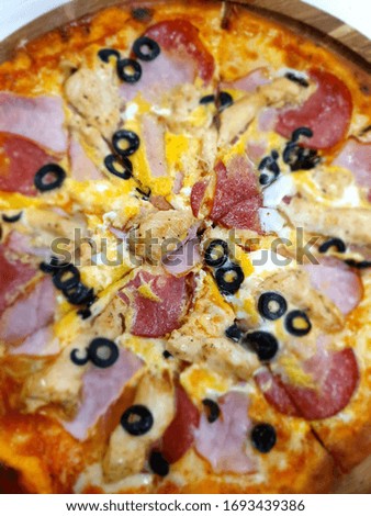 Tasty juicy fresh italian pizza. Traditional Italian cuisine. Delicacies. Pizza with Olives and Cheese