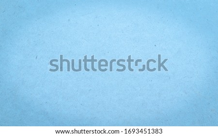 blue sheet of paper with visible texture