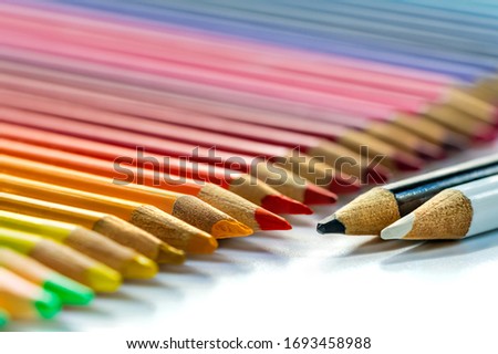 Colorful pencils as background - closeup with selective focus