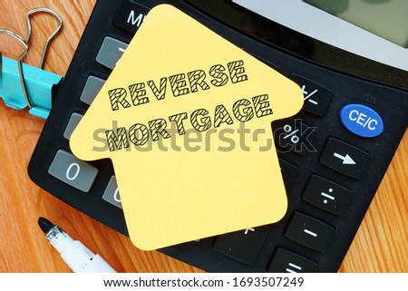 Conceptual photo showing printed text reverse mortgage
