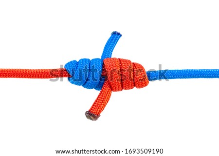 Two red and blue cords are connected . Knot on a cord isolated on a white background .