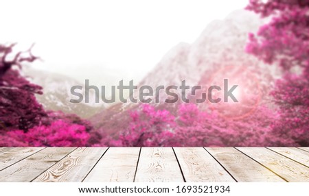 Wooden desk in front of the purple mountain landscape