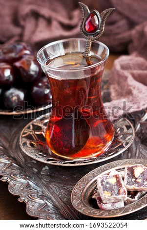 Turkish  tea  served with Turkish Delight, selective focus with shallow depth of field