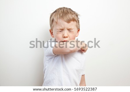 Cough in the elbow. Prevention barrier gestures to curb the covid-19 Royalty-Free Stock Photo #1693522387