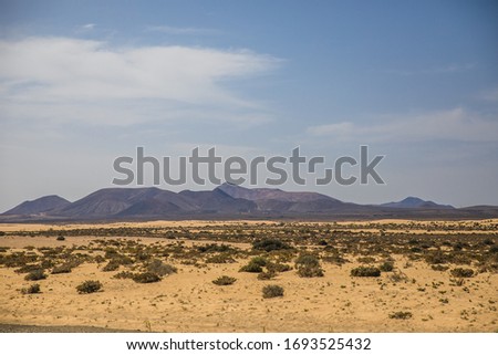 landscape view with mountains and sky and clouds