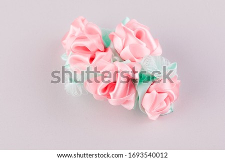 Handmade soft hair clip in the shape of rose flowers made of kanzashi ribbons