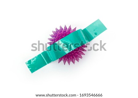A coronavirus taped to the white background of the wall. The end of covid-19 ncov concept. Popular image. New trend in photography. A conceptual look at modern art. Artistic picture.