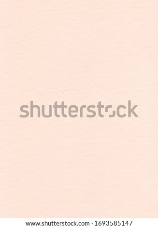 Elegant beige paper background. Sandy and peachy colored pastel paper. Warm modern textured sheet of paper. Abstract homogeneous flatlay, top view. Vertical format. Free space for your text