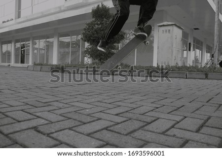Man Ollie Tricks On Skateboard
