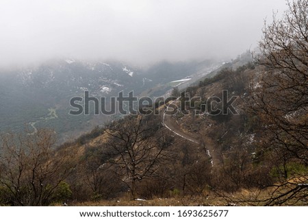 Rock stone road in mist day with tire imprint for automobile commercial. March 18, 2020 Turkey