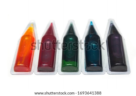 Closeup of food coloring palette on white background
