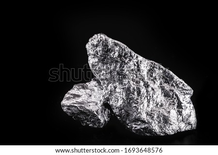 chrome stone extracted from mine, isolated black background.