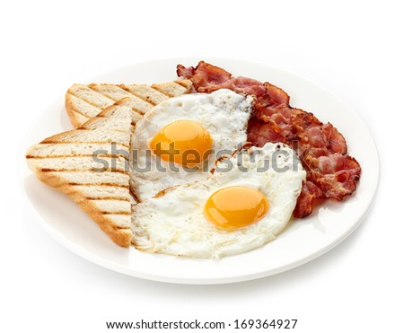 Plate of breakfast with fried eggs, bacon and toasts isolated on white background Royalty-Free Stock Photo #169364927