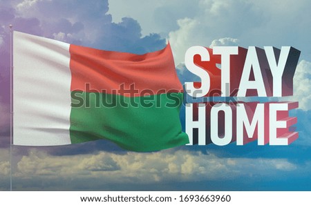 Stay home stay safe - letter typography 3D text for self quarantine times concept with flag of Madagascar. 3D illustration.